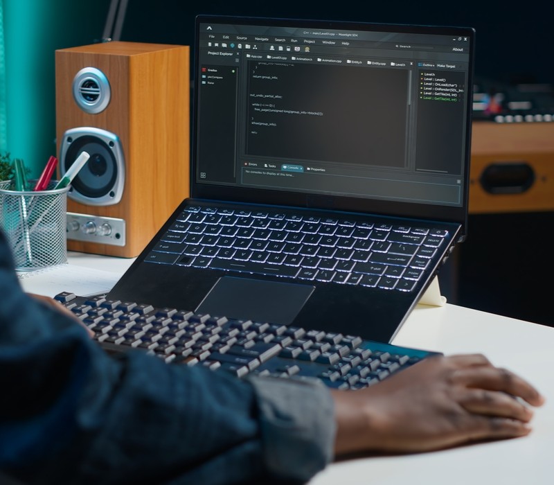 Teleworker using laptop to do coding for software developing